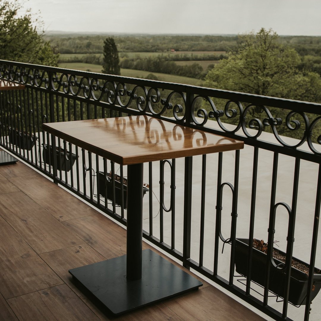 wooden-table-balcony-with-iron-fence-1080x1080
